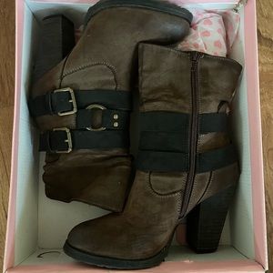 Mid length brown heeled boots with strap